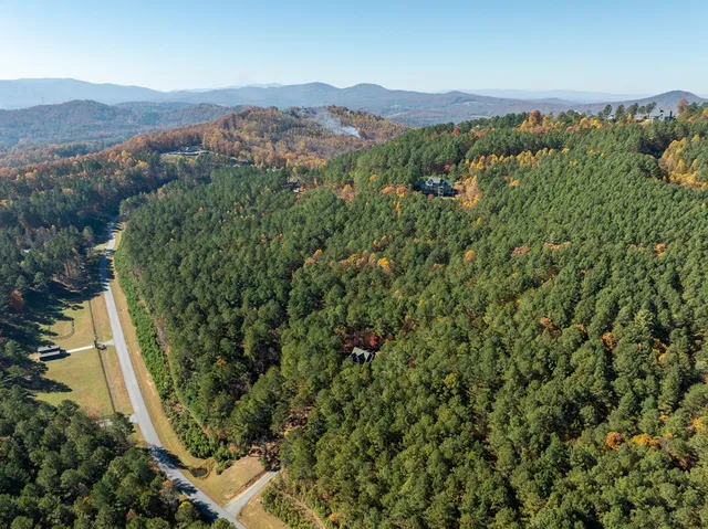 a kitchen with stainless steel appliances a stove a refrigerator and cabinets