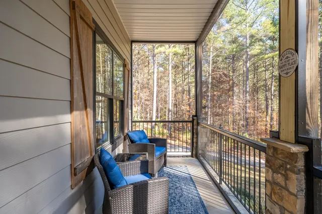 a dining room with wooden floor and a chandelier