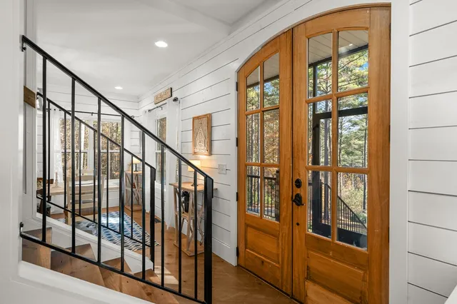 a view of a room with furniture and a window