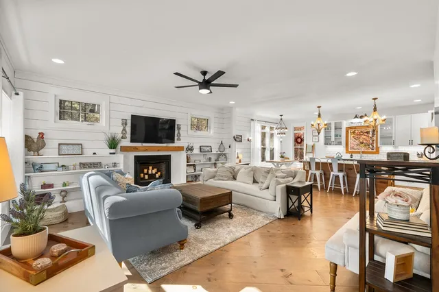 a view of hallway with stairs and wooden floor