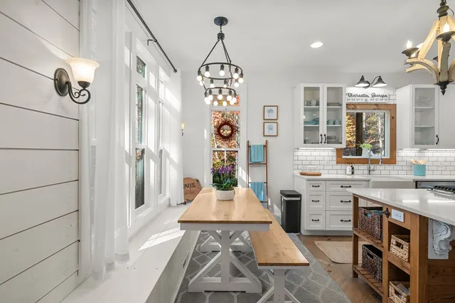 a spacious bedroom with a bed and a fireplace