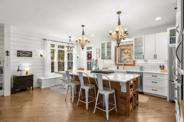 a bathroom with a sink a mirror and a shower