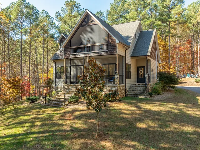 a view of a patio with couches chairs and a potted plant
