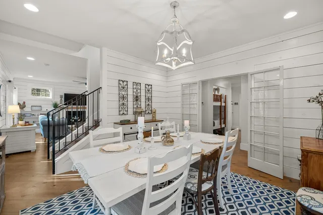 a room with pool table and glass windows