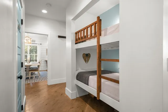 a view of a house with backyard water fountain and sitting area