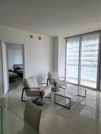 a kitchen with a refrigerator and a sink
