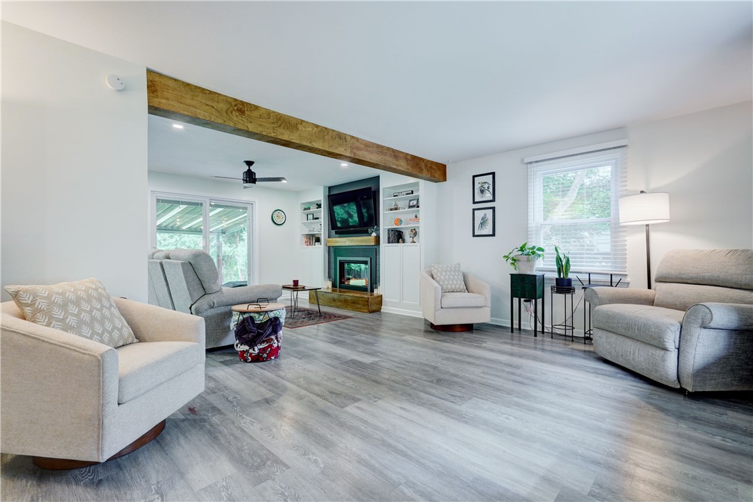 As you enter, the family room and living room are