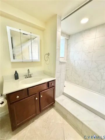 a bathroom with a shower and a window