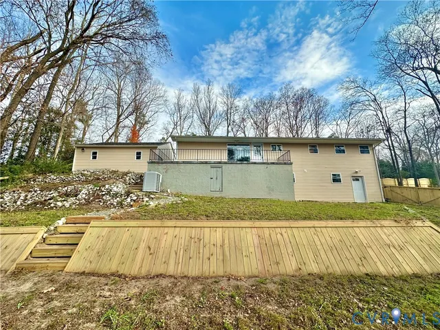 a view of a backyard with large trees