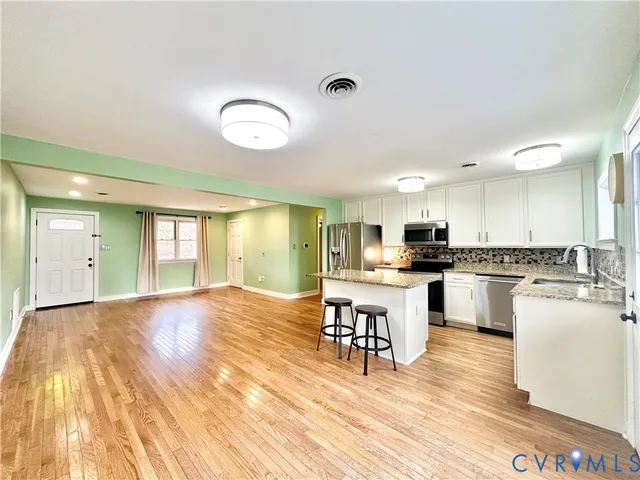 a view of a swimming pool with an outdoor space and seating area