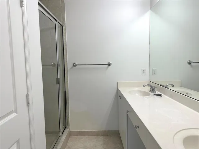 a bathroom with a sink and mirror