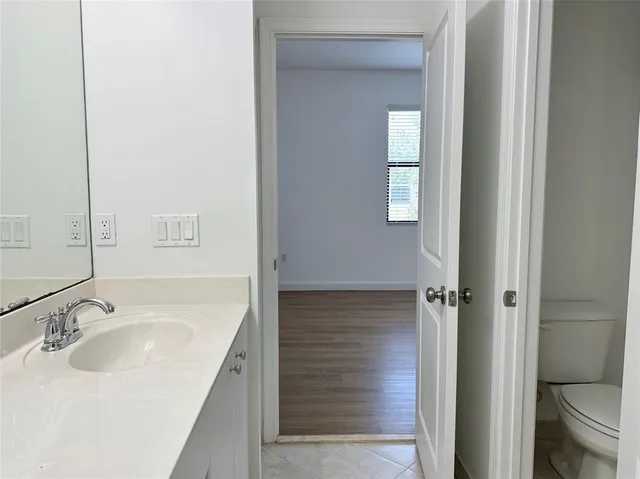 a bathroom with a sink and toilet