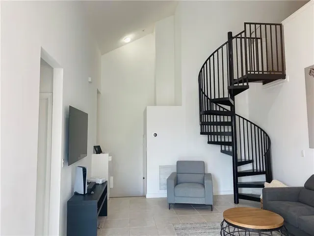 a view of entryway and workspace with wooden floor