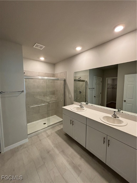 20461 Camino Torcido Loop North Fort Myers, FL 33917 - Photo 13 of 17 a bathroom with a shower sink and mirror
