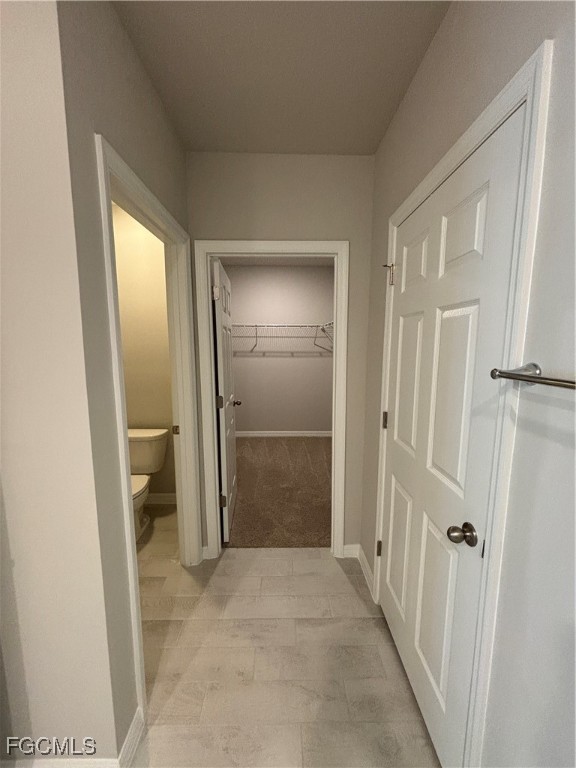 20461 Camino Torcido Loop North Fort Myers, FL 33917 - Photo 14 of 17 a view of a hallway with wooden walls and entryway