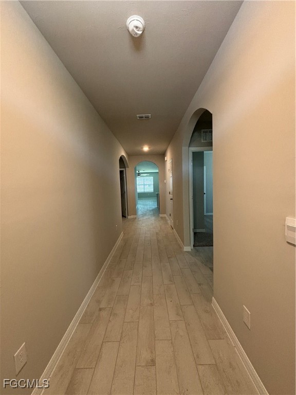 20461 Camino Torcido Loop North Fort Myers, FL 33917 - Photo 2 of 17 a view of a hallway with wooden floor