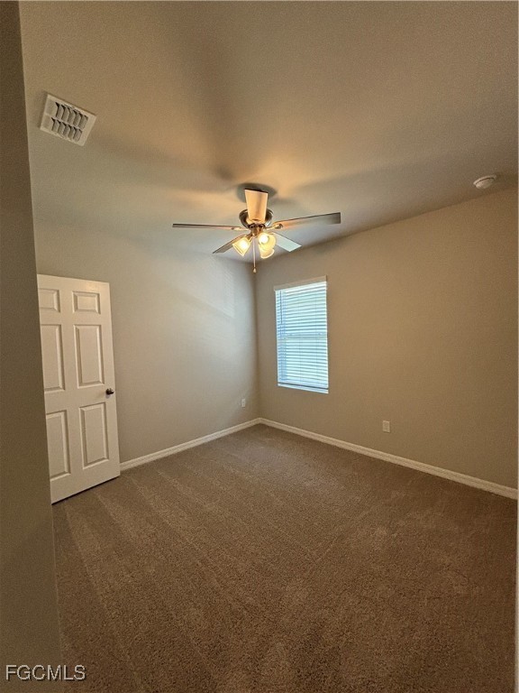 20461 Camino Torcido Loop North Fort Myers, FL 33917 - Photo 3 of 17 an empty room with windows and chandelier fan