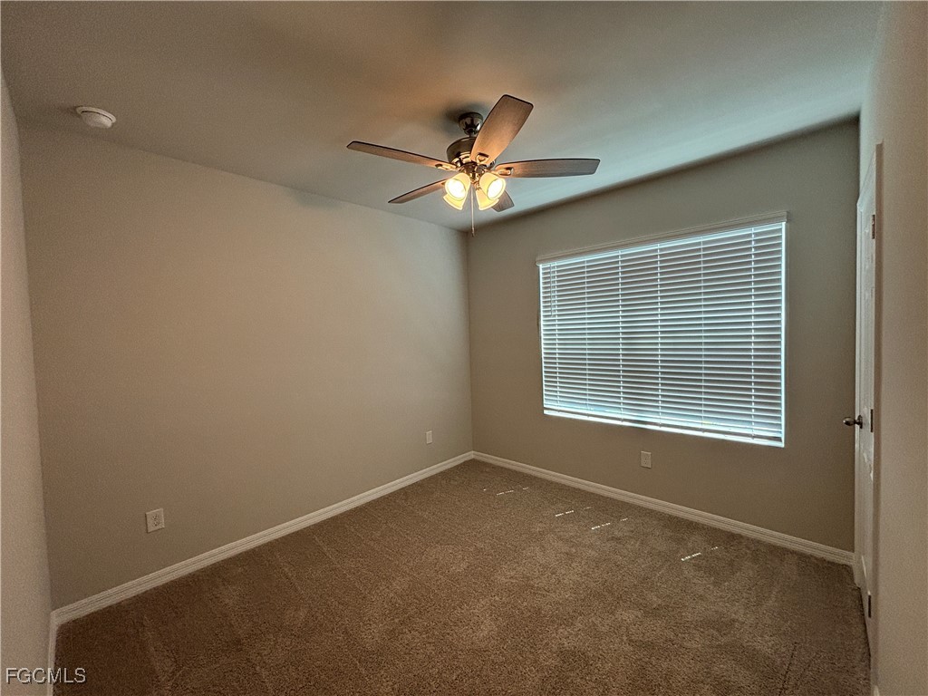 20461 Camino Torcido Loop North Fort Myers, FL 33917 - Photo 5 of 17 a view of an empty room with a window