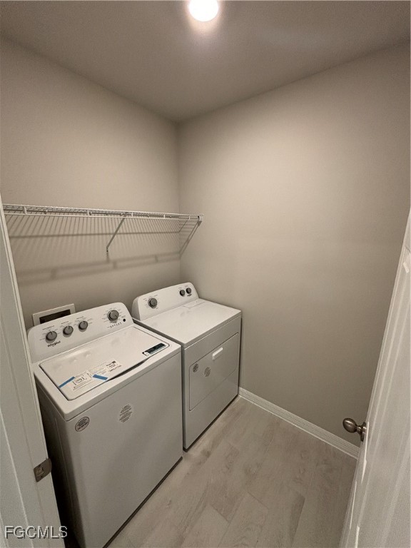 20461 Camino Torcido Loop North Fort Myers, FL 33917 - Photo 7 of 17 a utility room with dryer and washer