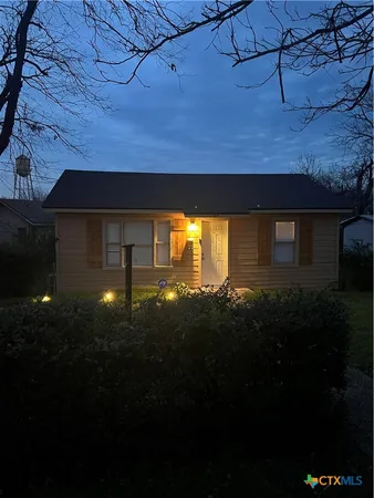 a view of a backyard of the house