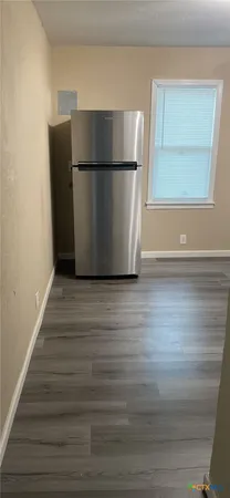 a view of kitchen with wooden floor