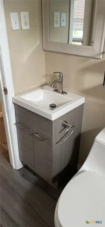 a bathroom with a sink and a toilet