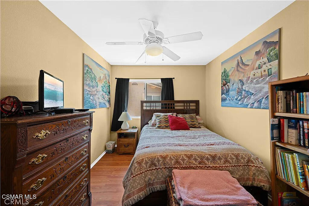 4492 Apricot Road, Unit B Simi Valley, CA 93063 - Photo 14 of 24 a bedroom with a bed and a flat screen tv