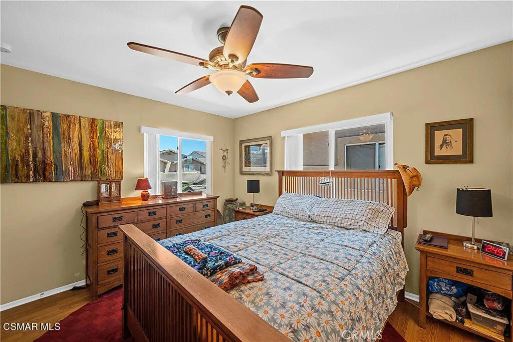 4492 Apricot Road, Unit B Simi Valley, CA 93063 - Photo 16 of 24 a bedroom with a bed and a chandelier