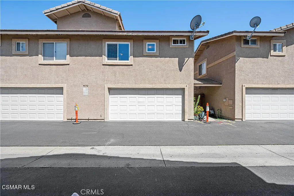 4492 Apricot Road, Unit B Simi Valley, CA 93063 - Photo 21 of 24 a front view of a house with a road