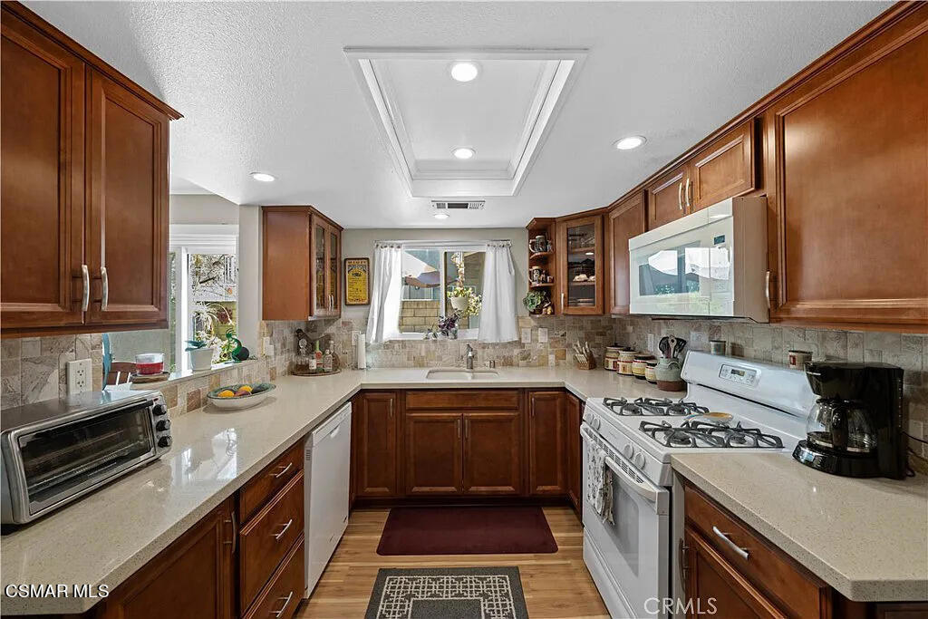 4492 Apricot Road, Unit B Simi Valley, CA 93063 - Photo 9 of 24 a kitchen with a sink stove and microwave