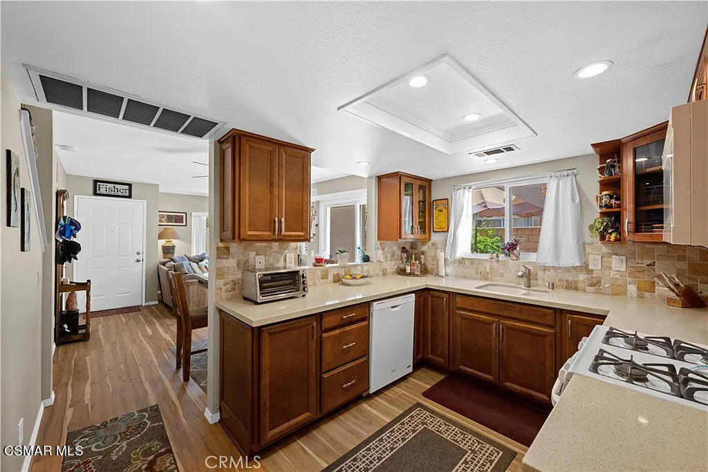 4492 Apricot Road, Unit B Simi Valley, CA 93063 - Photo 10 of 24 a kitchen with stainless steel appliances granite countertop a sink stove and cabinets
