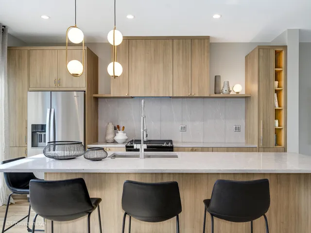 a kitchen with a sink cabinets and window