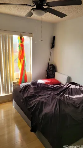 a bathroom with a toilet and a shower curtain