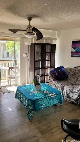 a kitchen with stainless steel appliances a stove a microwave and white cabinets