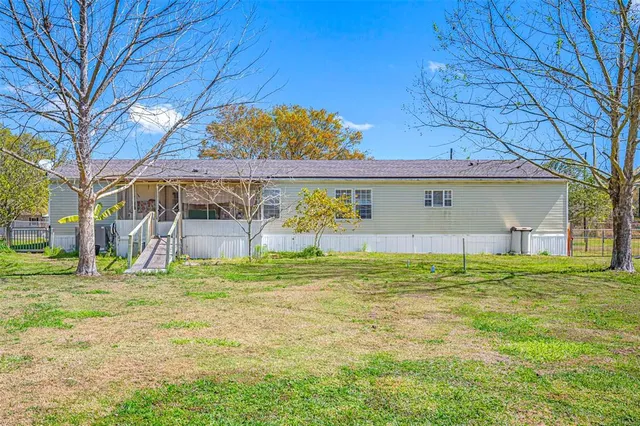 a view of a patio with table and chairs