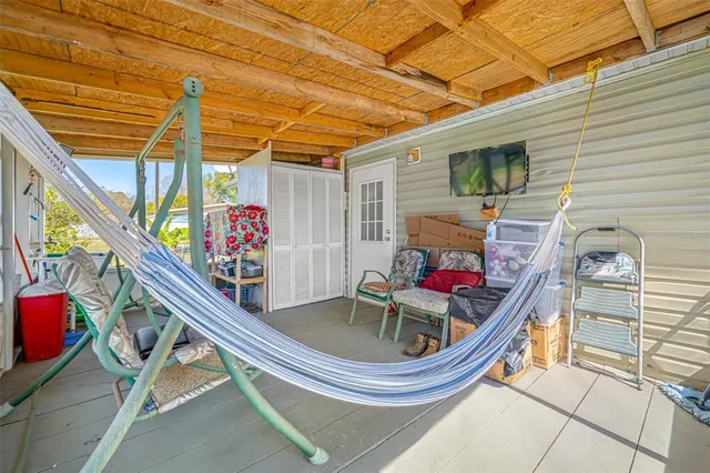a living room with furniture and flat screen tv