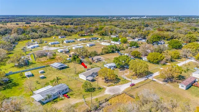 an aerial view of residential houses with outdoor space