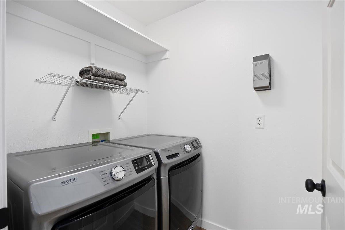 1897 Hampton Way Twin Falls, ID 83301 - Photo 16 of 48 Laundry room featuring washer and clothes dryer and baseboards