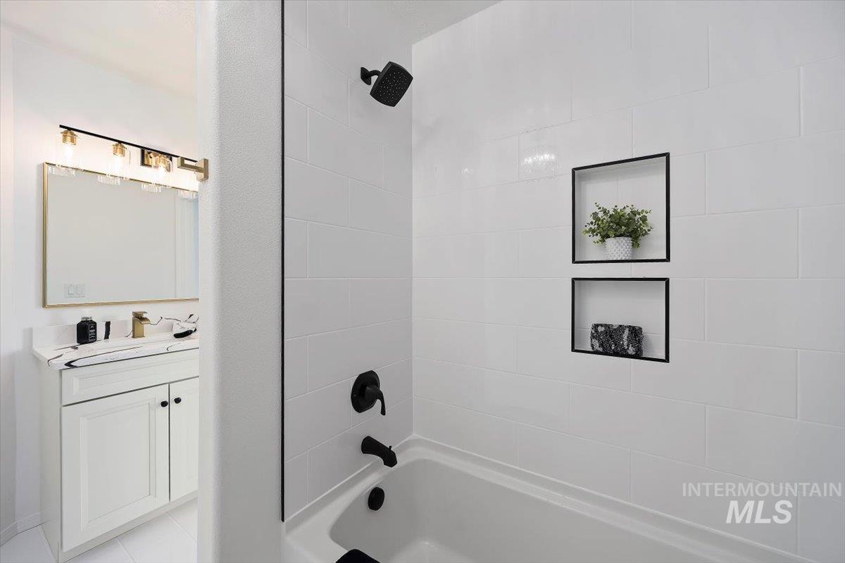 1897 Hampton Way Twin Falls, ID 83301 - Photo 23 of 48 Bathroom featuring vanity and tub / shower combination