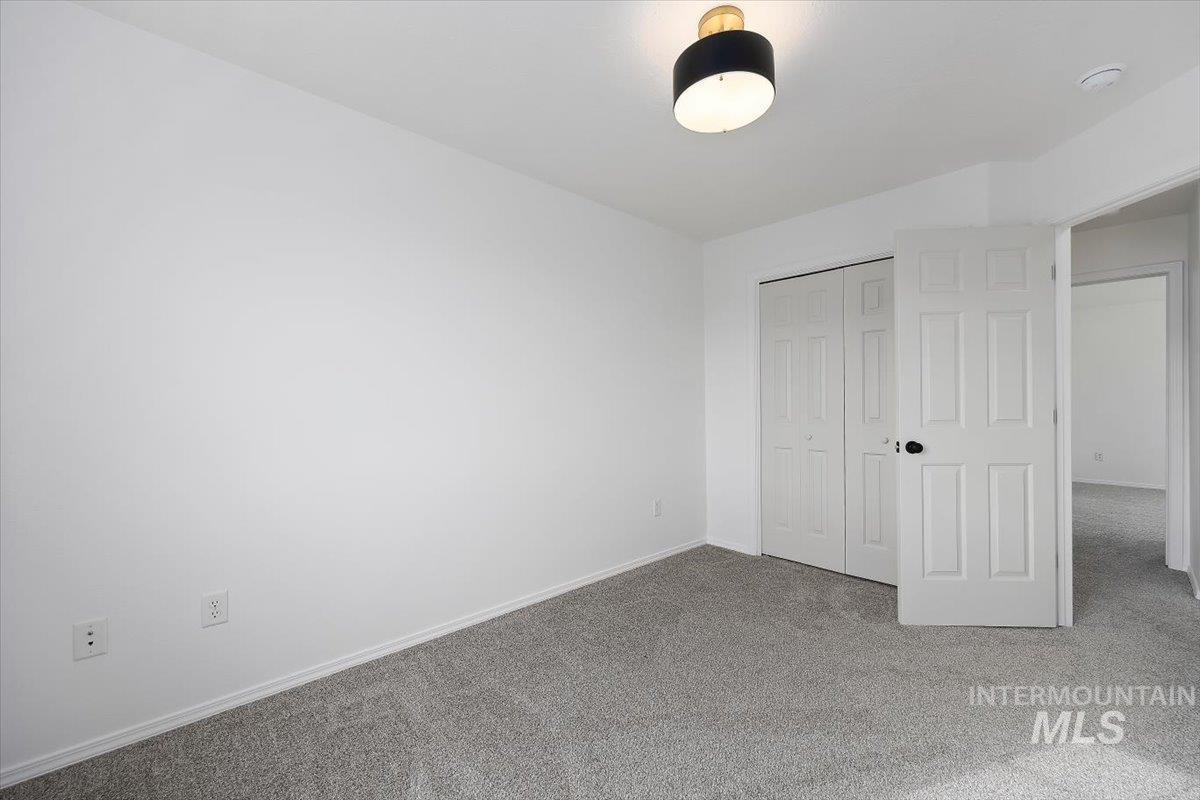 1897 Hampton Way Twin Falls, ID 83301 - Photo 25 of 48 Unfurnished bedroom featuring carpet floors and a closet