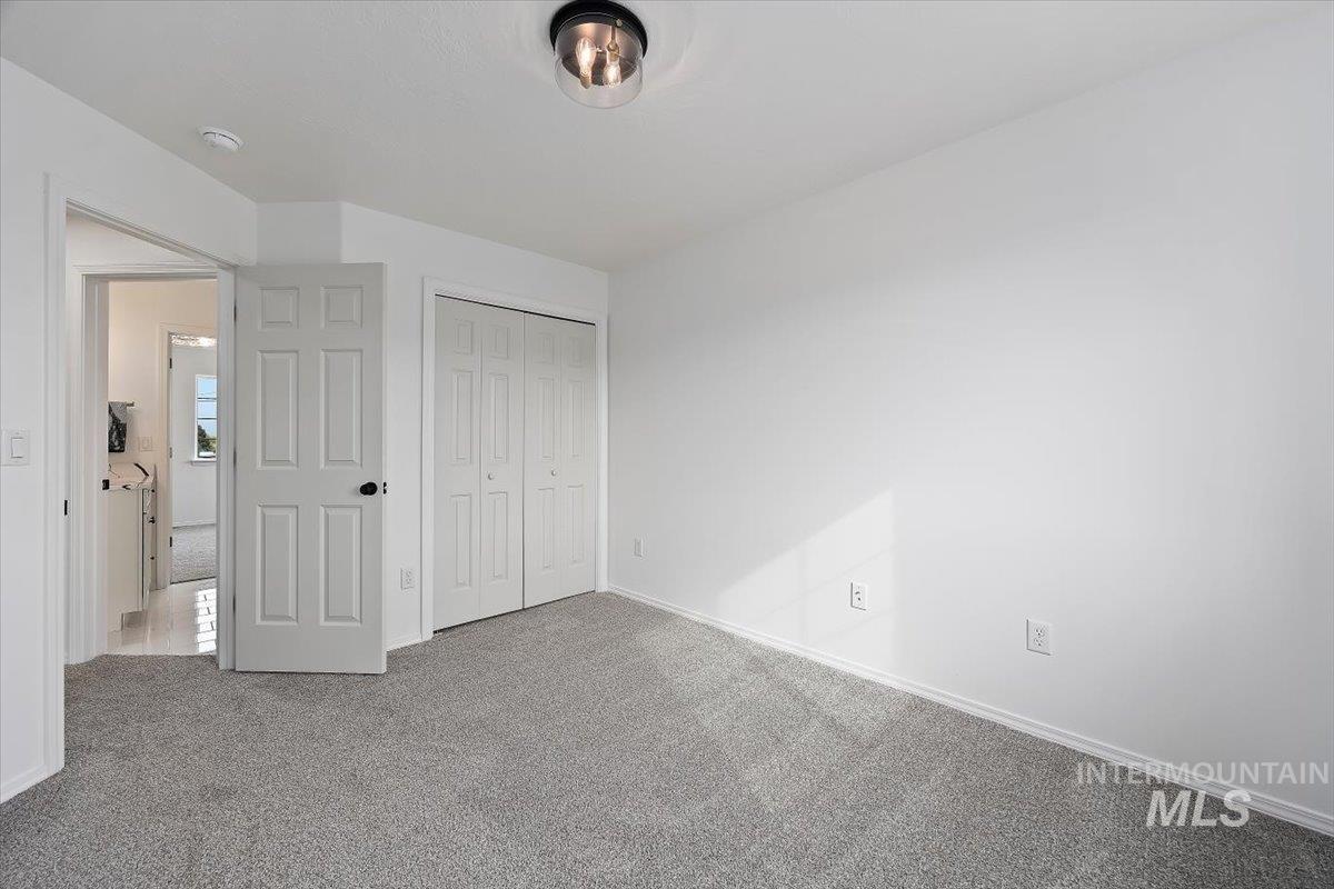 1897 Hampton Way Twin Falls, ID 83301 - Photo 27 of 48 Unfurnished bedroom featuring carpet flooring and a closet