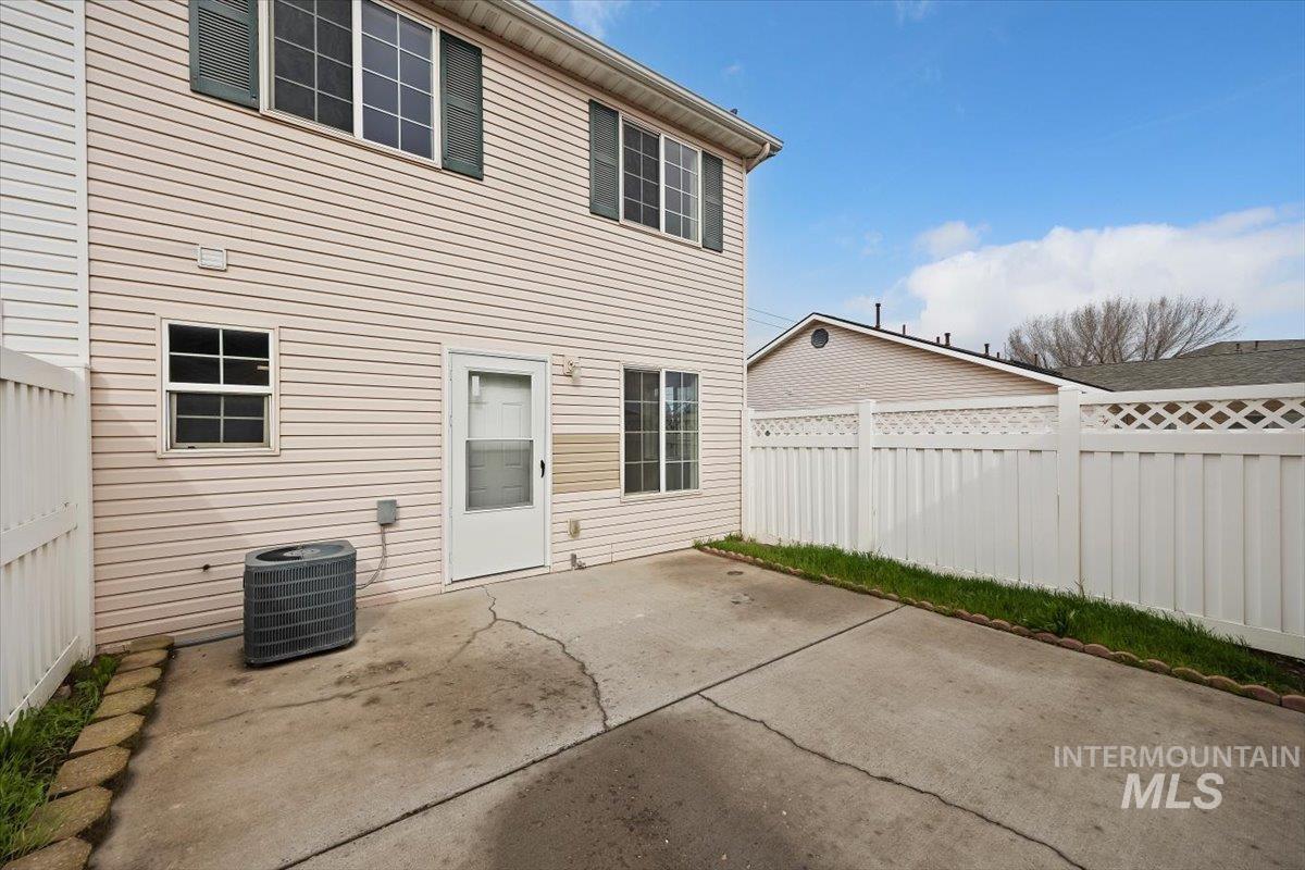 1897 Hampton Way Twin Falls, ID 83301 - Photo 30 of 48 Back of house featuring a patio area and a fenced backyard