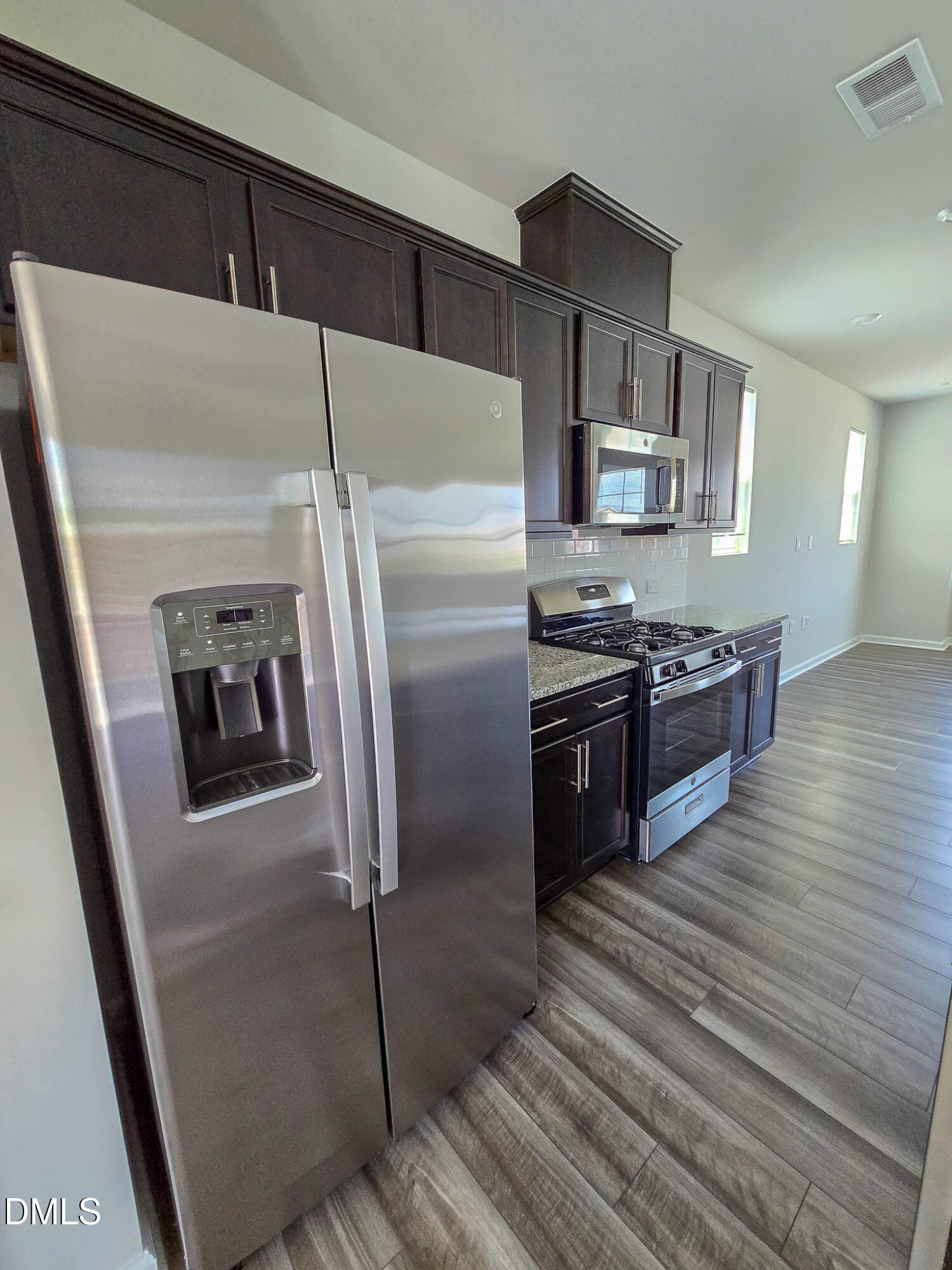2431 Kasota Lane Raleigh, NC 27610 - Photo 14 of 46 a kitchen with stainless steel appliances granite countertop a refrigerator and a stove