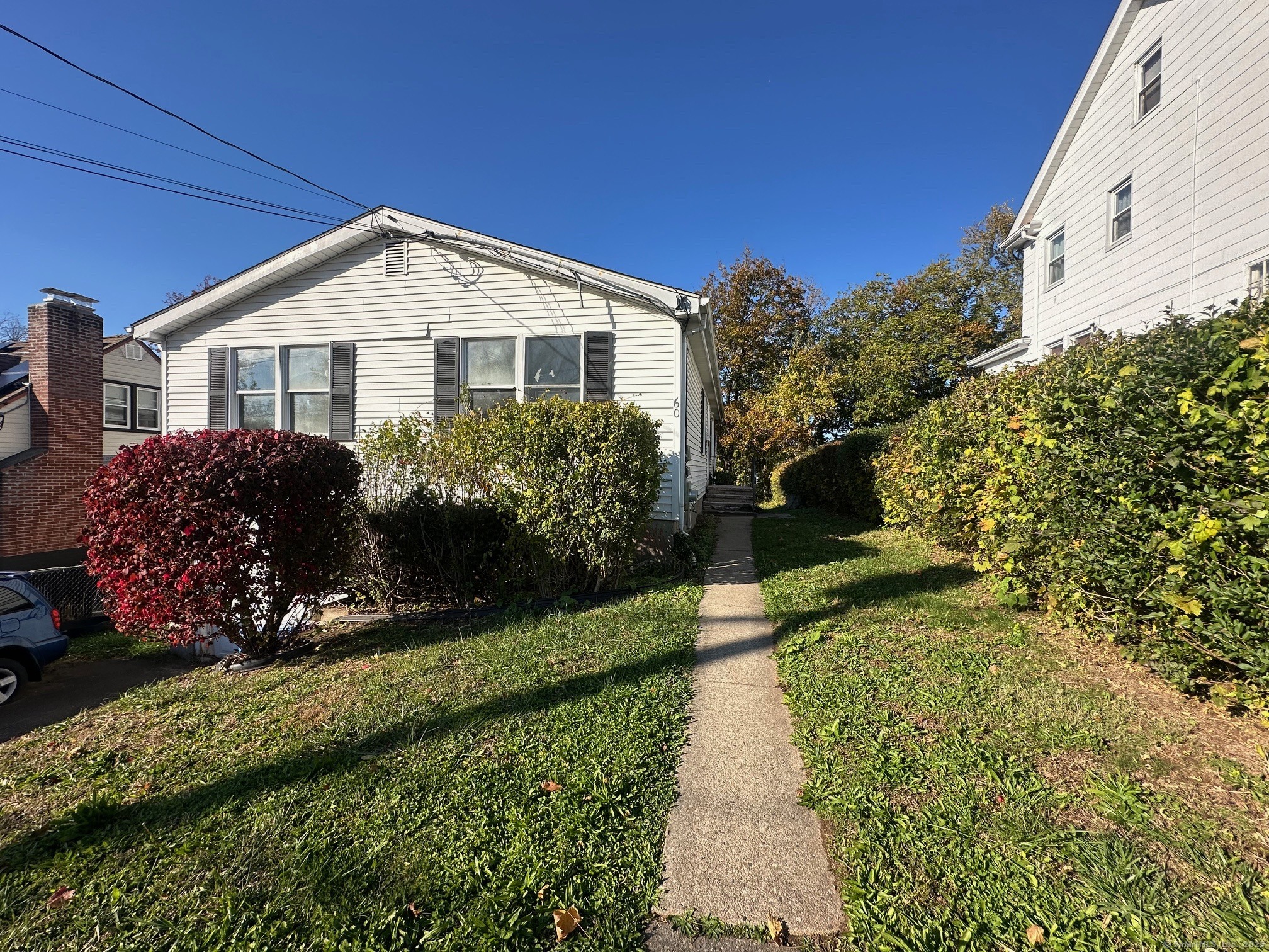 60 Coolidge Street Hartford, CT 06106 - Photo 2 of 13 a front view of a house with a yard