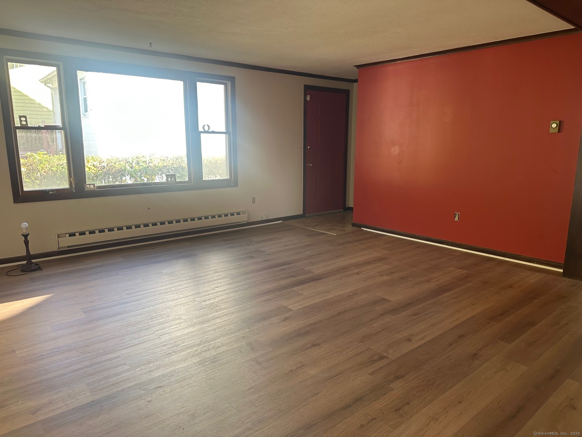 60 Coolidge Street Hartford, CT 06106 - Photo 5 of 13 an empty room with wooden floor and windows
