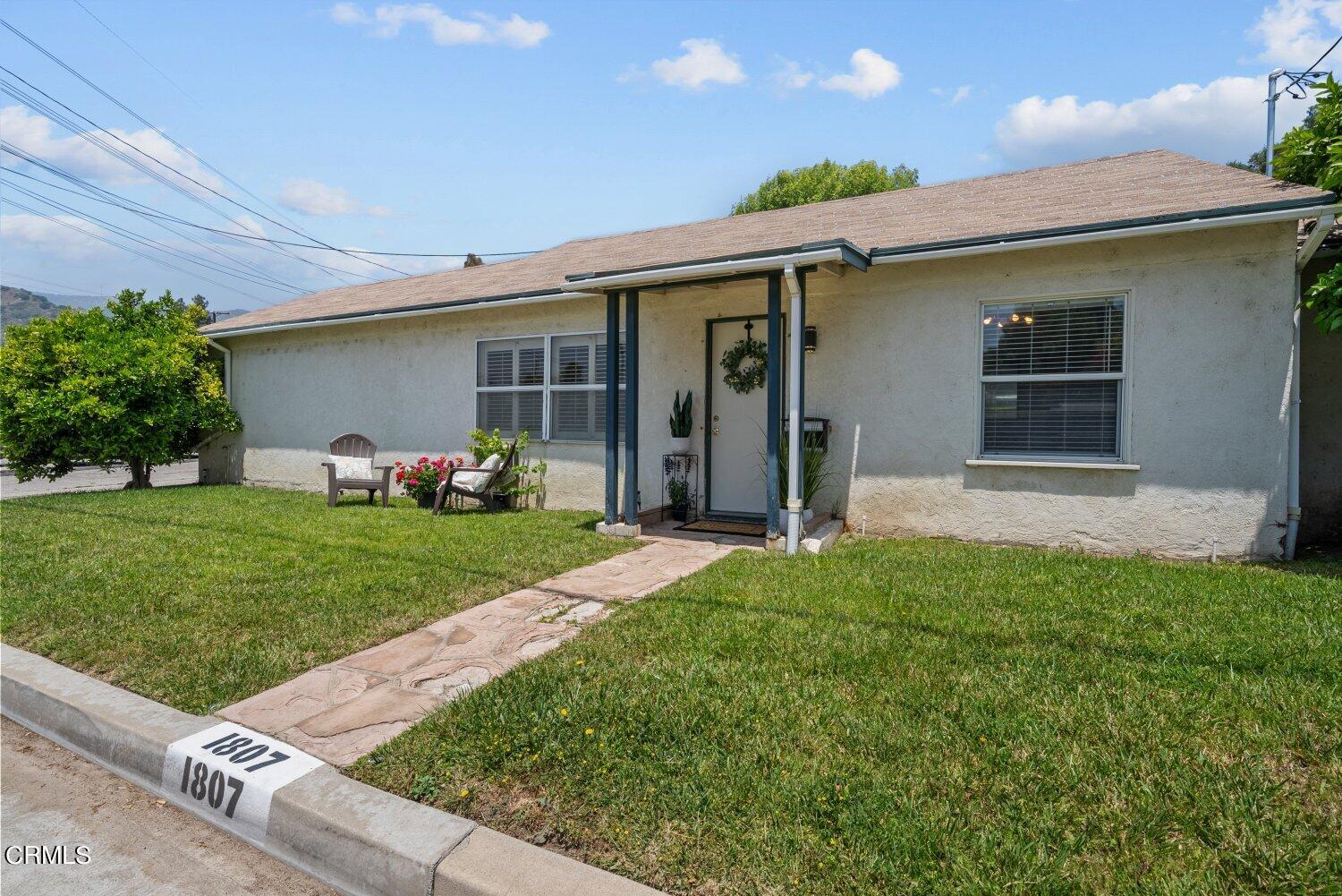 a front view of house with yard