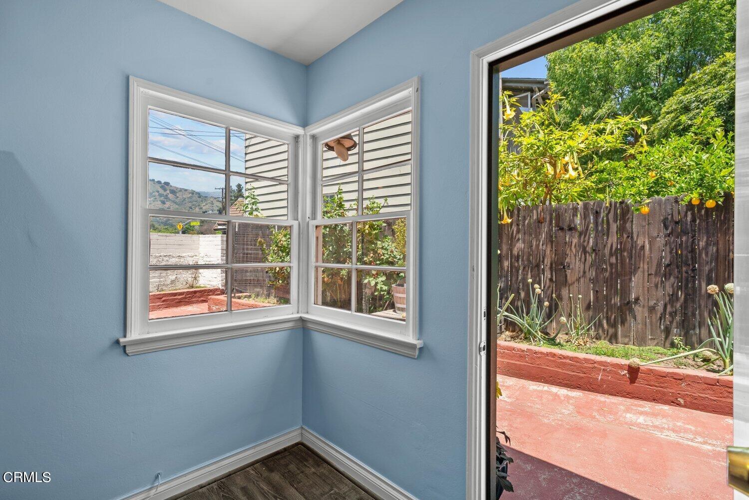 1807 Alpha Road Glendale, CA 91208 - Photo 16 of 26 a view of a room that has a window and wooden floor