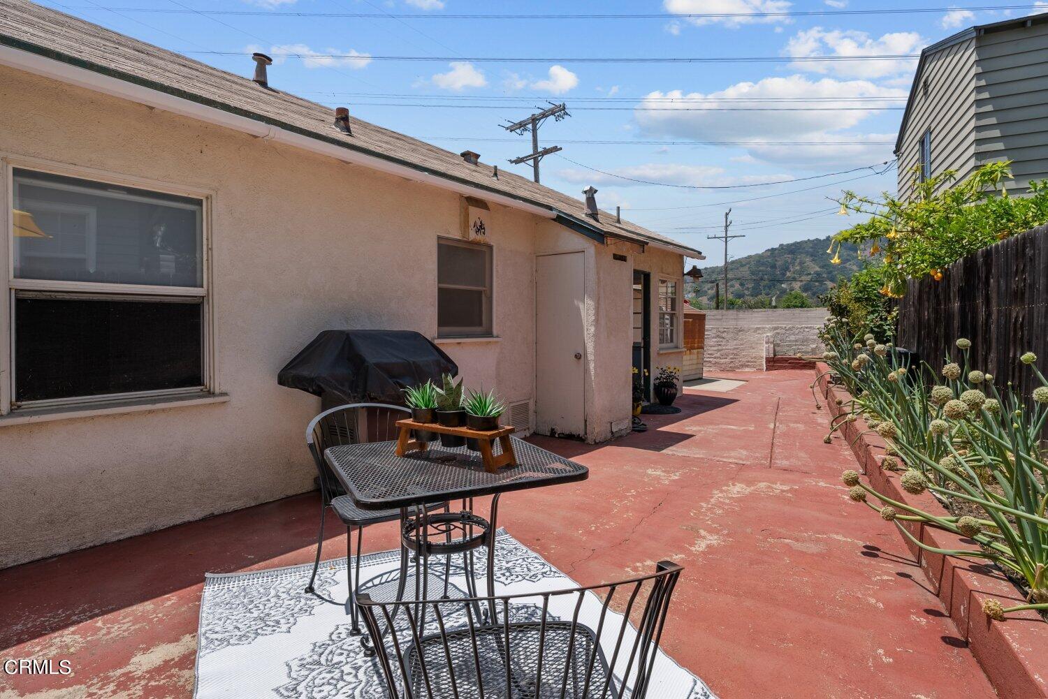 1807 Alpha Road Glendale, CA 91208 - Photo 20 of 26 a backyard of a house with table and chairs