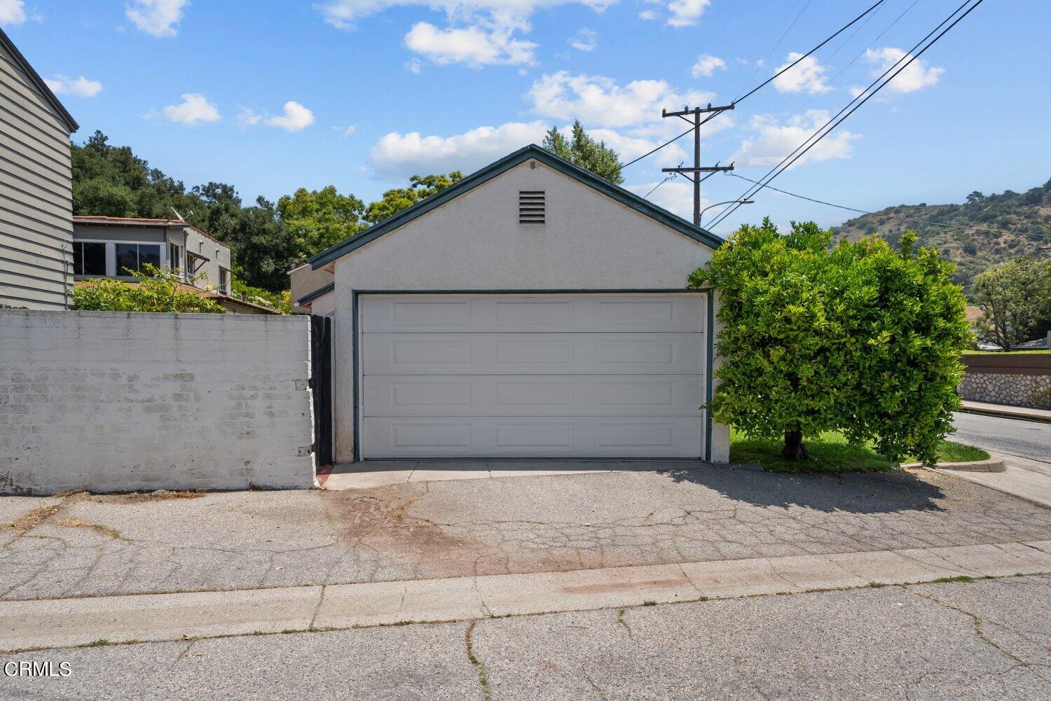 1807 Alpha Road Glendale, CA 91208 - Photo 21 of 26 a view of a house with a yard and garage