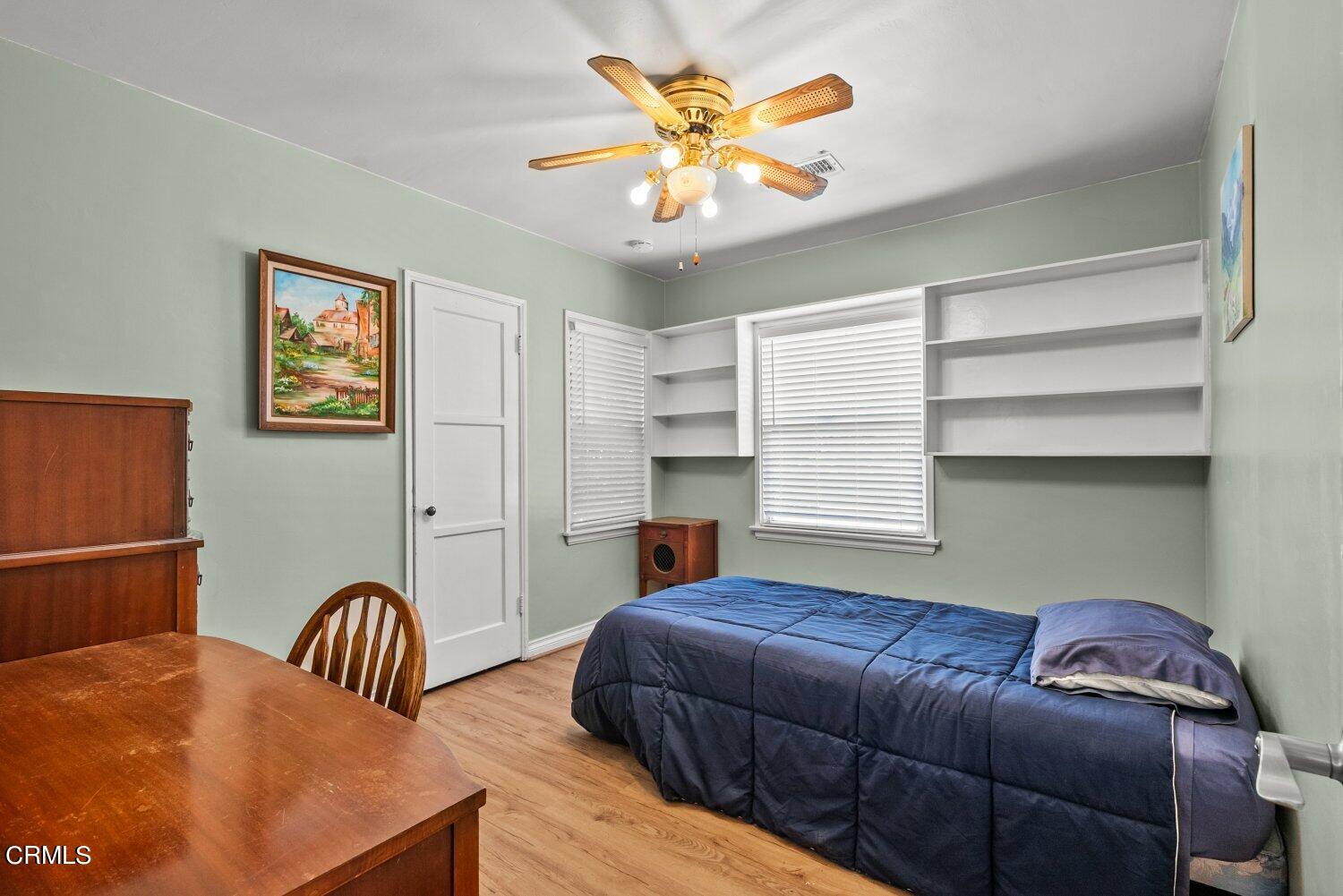 1807 Alpha Road Glendale, CA 91208 - Photo 8 of 26 a bedroom with furniture and a chandelier